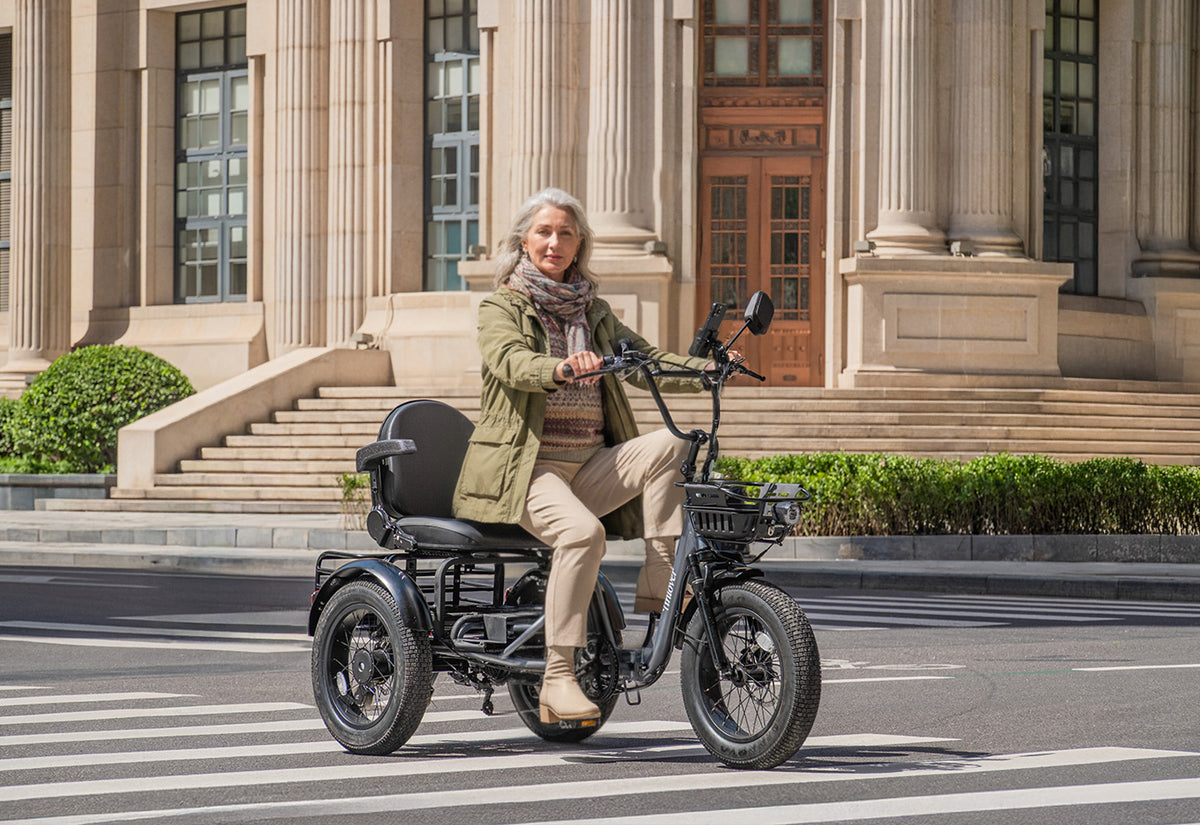 Tiniover Creek electric trike with an older adult woman rider on a city street